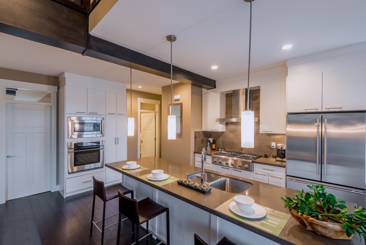 Bright modern kitchen wiped down and restocked for guest check-in